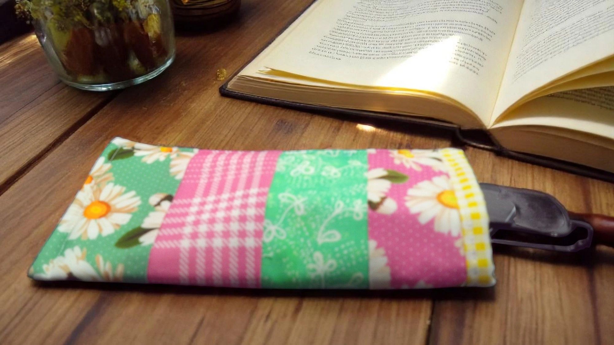 Colorful patchwork mug rugs and quilted book sleeves laid flat — new arrivals from Reading Well Handmade